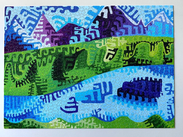 An image of "Denali" an oil painting featuring bright blues, greens and purples with geometric shapes and lines that has been made into a puzzle