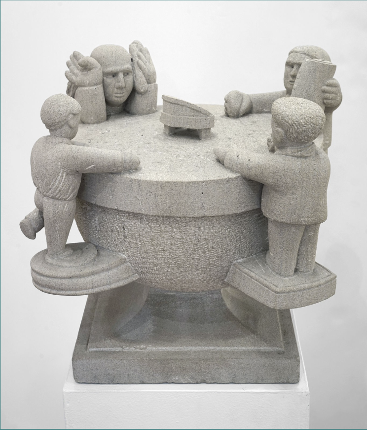 A round half-circle with a flat top and a square base. Around the circumference are four figures, each standing on a ledge that comes off the rounded semicircle. Two figures have their arms resting flat on the top. One has its hands up at the side of its face. The fourth figure is holding up a piece of paper with the text “YTTE” on it, honoring artist Achilles G. Rizzoli. YTTE, the name of his imaginary world, stands for “Yield to Total Elation.”