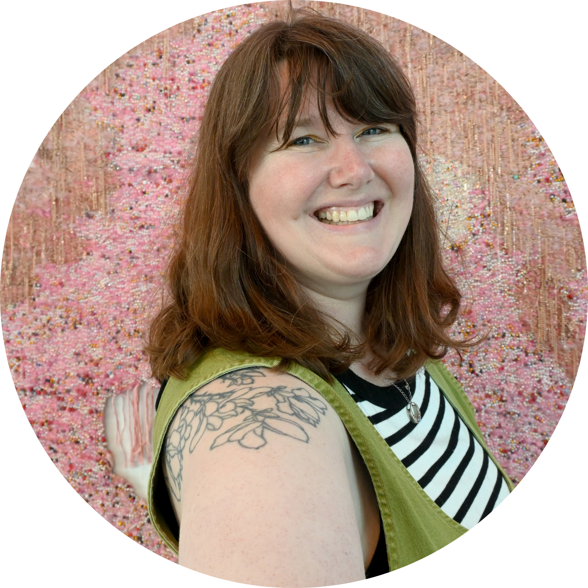 1 (1) a photo of Megan Bent - a white woman with fair skin and shoulder length brown hair with bangs, turned slightly on an angle and smiling