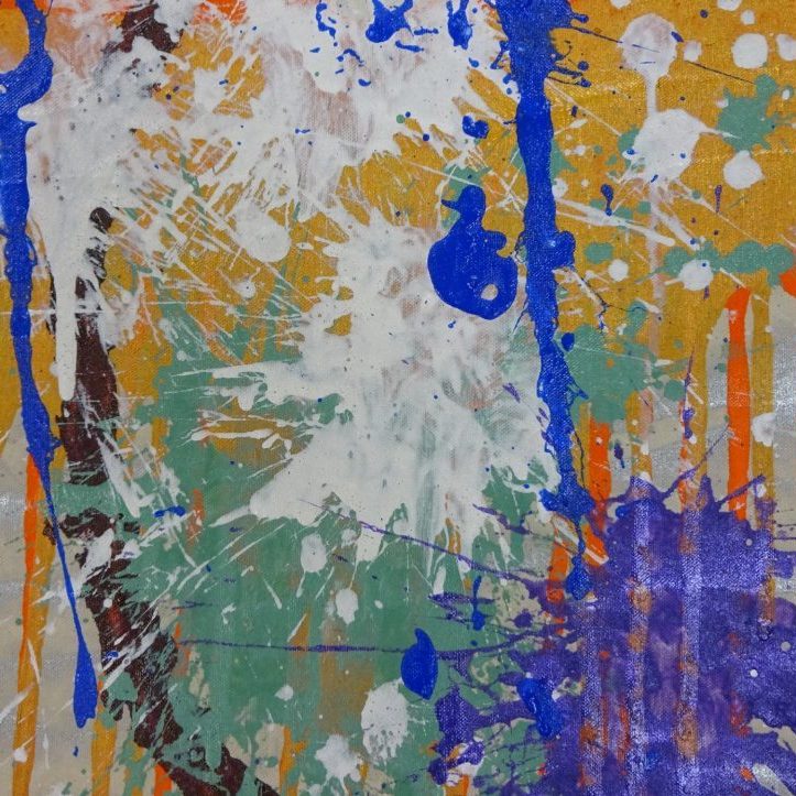 Silver canvas with drips of orange and splashes of purple, white, turquoise, and blue in the forefront.